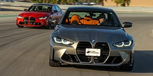 Dynamic shot of two BMWs driving on the course of the BMW Performance Driving School