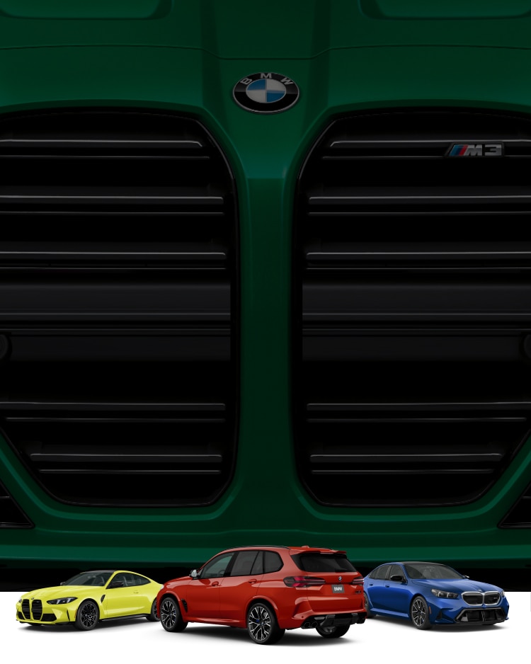Three colorful BMW M vehicles are parked near each other. A large BMW M3 kidney grille is in the background