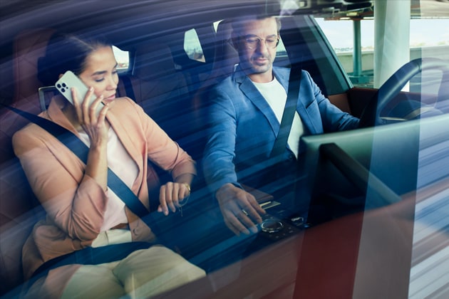 A BMW driver adjusts the glass controls in their BMW