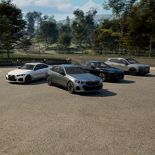A suite of 4 BMWs in an open parking area