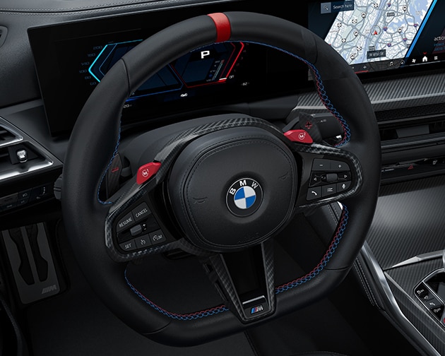 Detail shot of the three-spoke and leather-wrapped M Sport Steering wheel