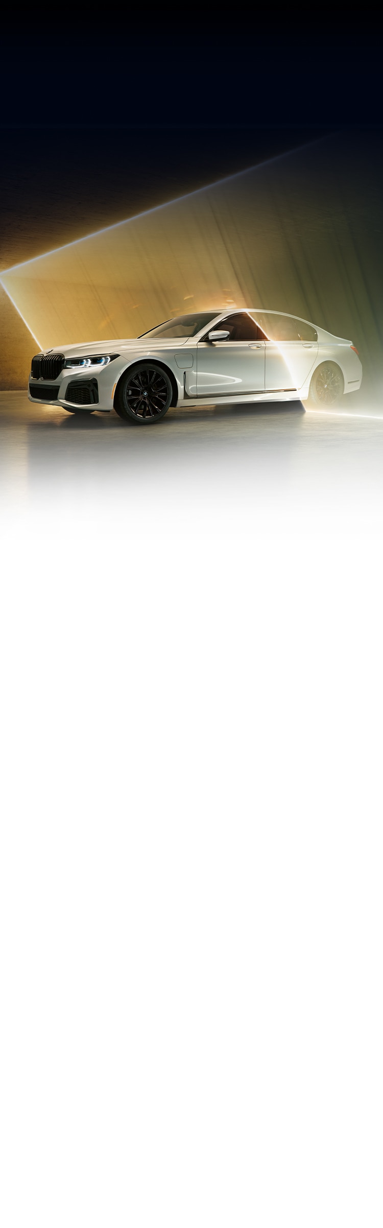 The 2022 7 Series 745e plug-in hybrid illuminated by bold light