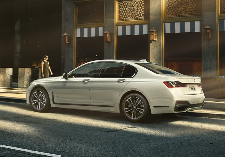A BMW Certified 7 Series 745e plug-in hybrid parked on a city street