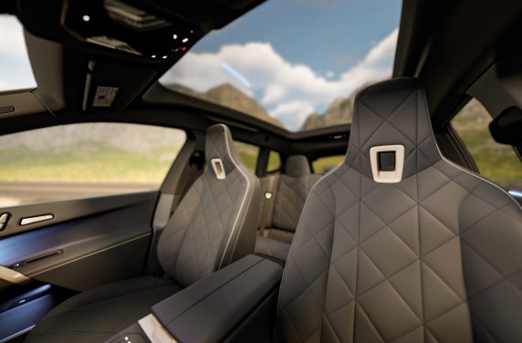 Interior shot of stylish and comfortable front seats inside a 2025 BMW iX.