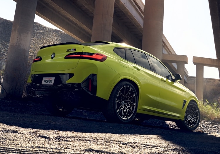 2025 BMW X4 M in Sao Paolo Yellow, showcasing new M-specific rear bumper design