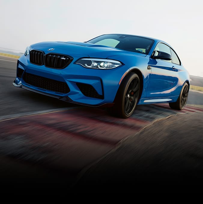Front shot of the Limited Edition BMW M2 CS turning a corner on the racetrack