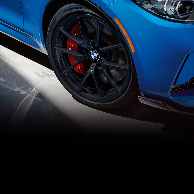 Detail of the 19" M wheels in Jet Black finish and M Sport brakes with red calipers on the Limited-Edition BMW M2 CS
