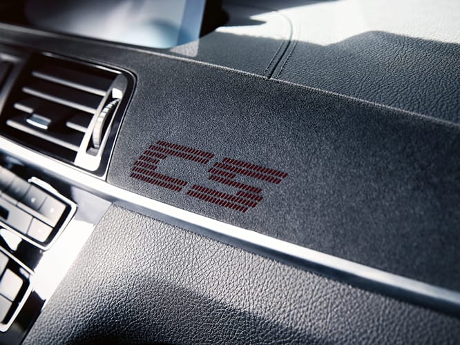 Front profile of the Limited Edition BMW M2 CS in Misano Blue Metallic driving on racetrack