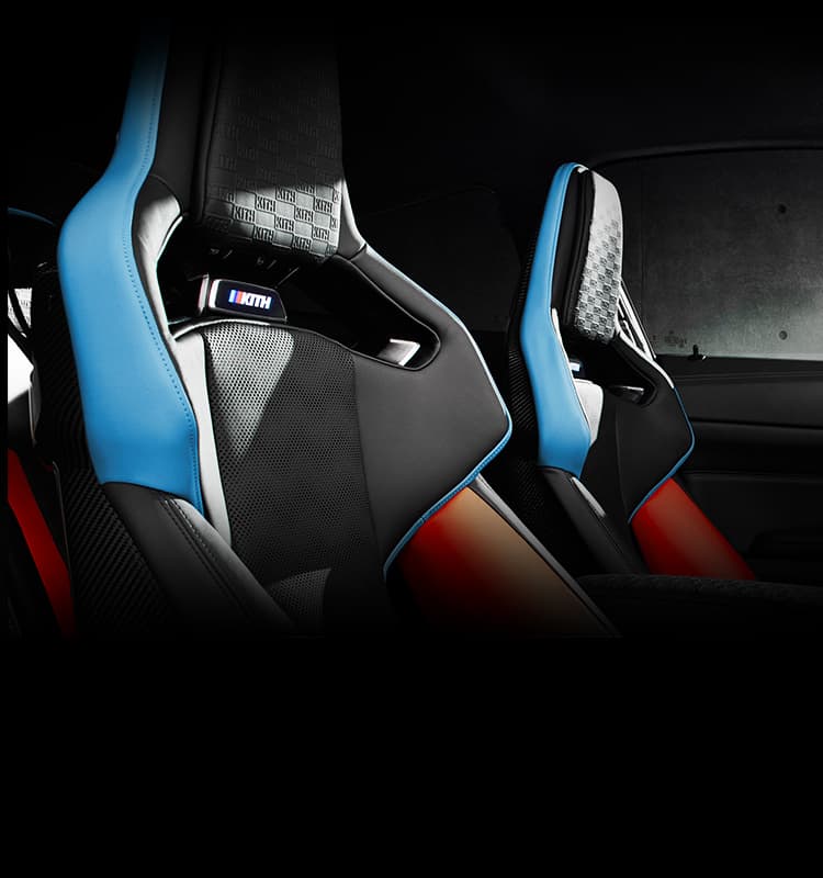 Interior of the 2022 BMW M4 Competition x Kith with M Carbon seats and illuminated badging