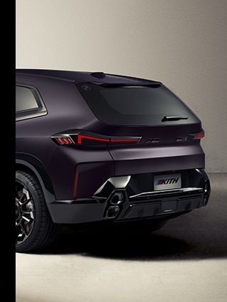 A three quarters shot of the back left section of the BMW XM by Kith featuring the Kith logo and limited edition badging